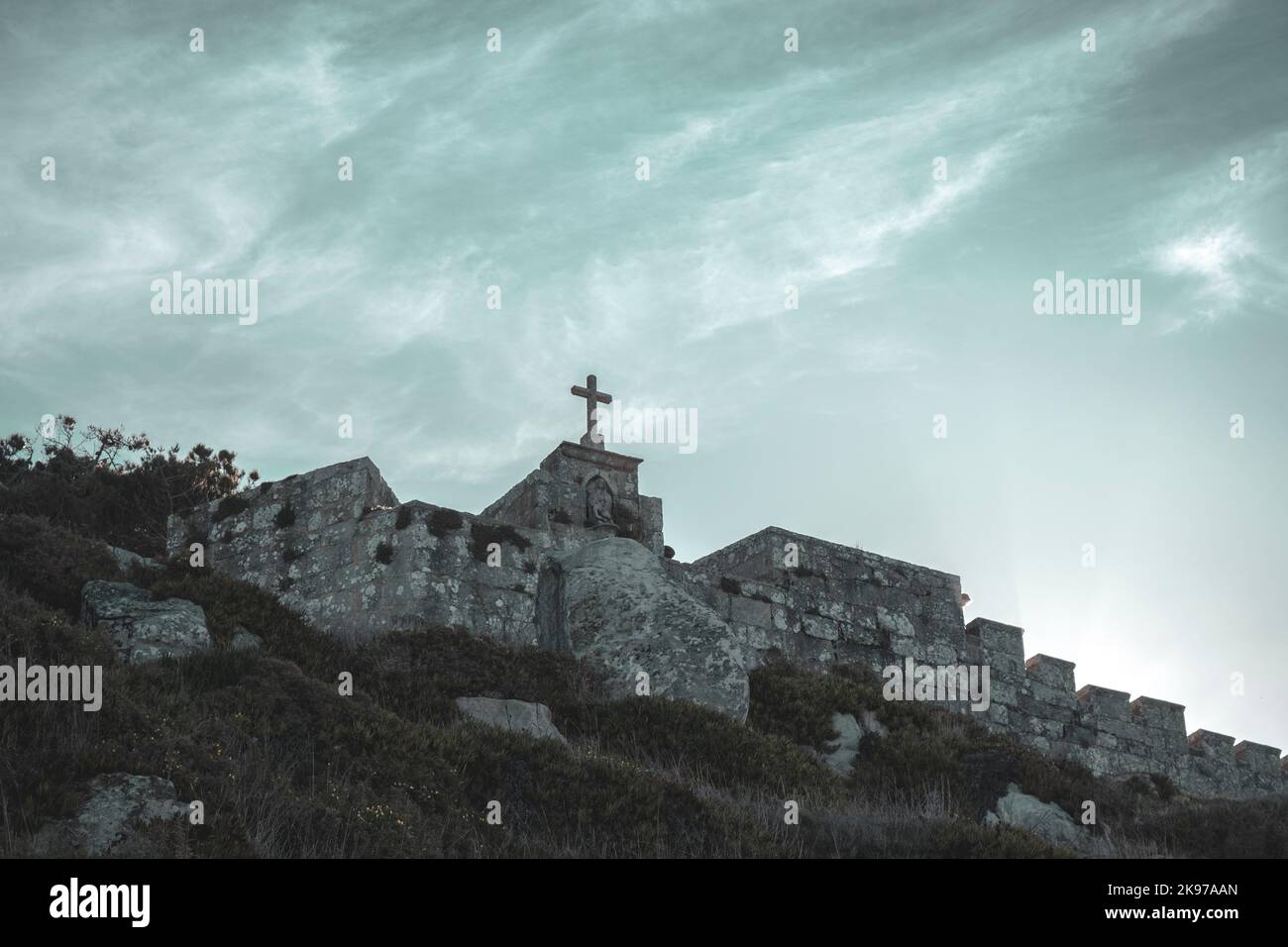 A low-angle shot of an old stone church on top of the hill Stock Photo ...