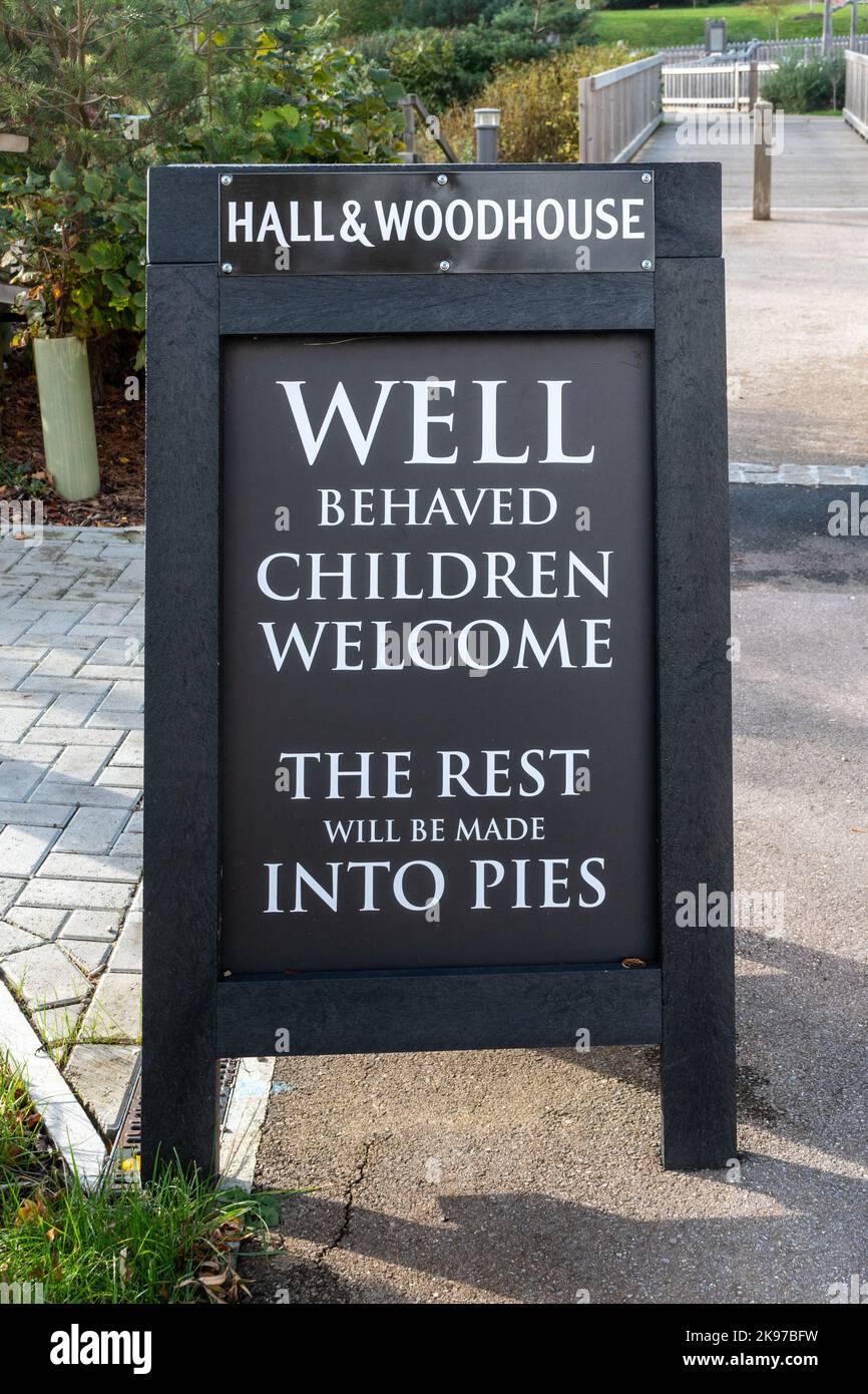 Amusing Hall & Woodhouse pub A-board sign, Well behaved children welcome, the rest will be made into pies Stock Photo