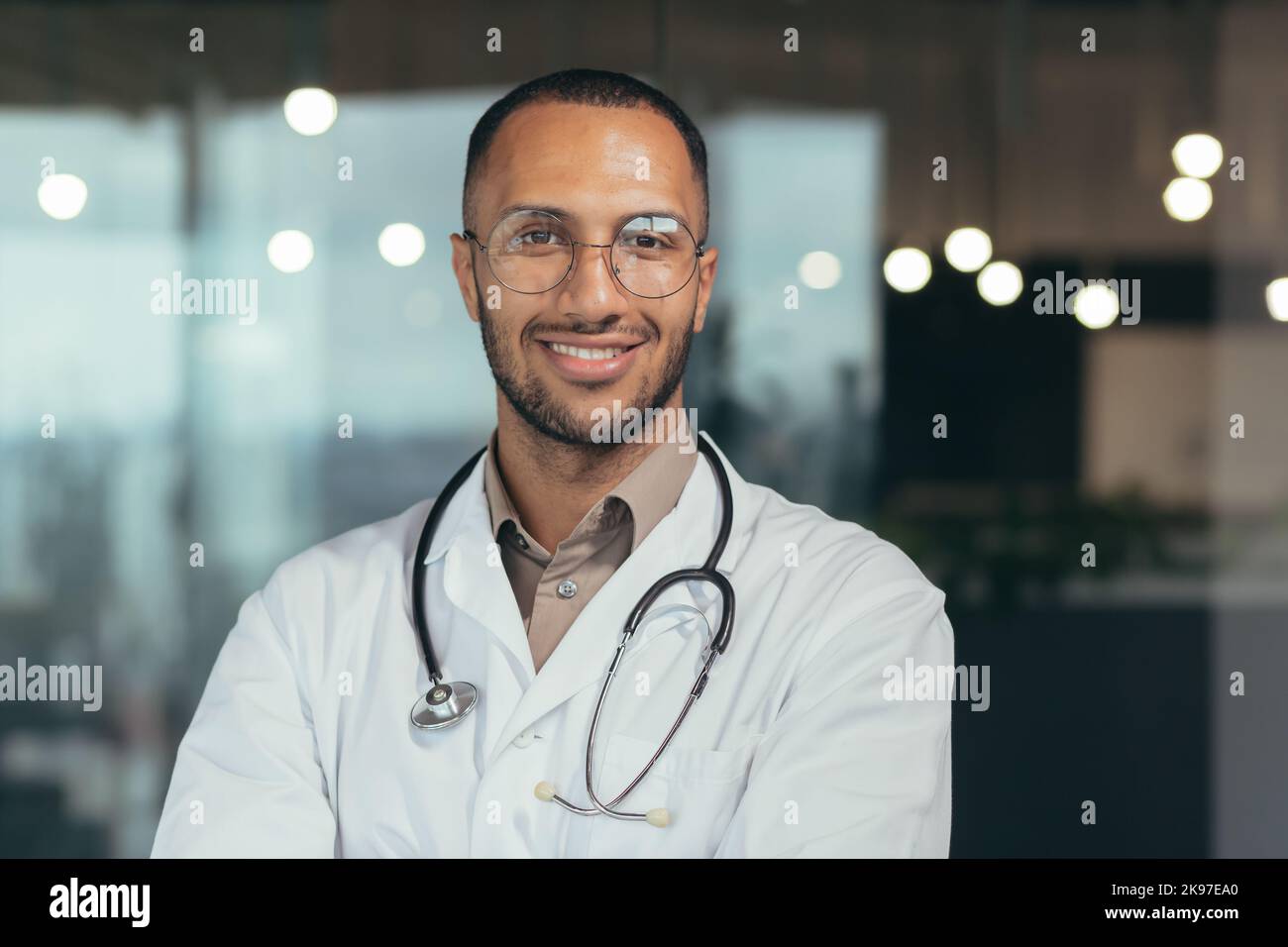 Close-up photo. Portrait of a young handsome male hispanic doctor ...