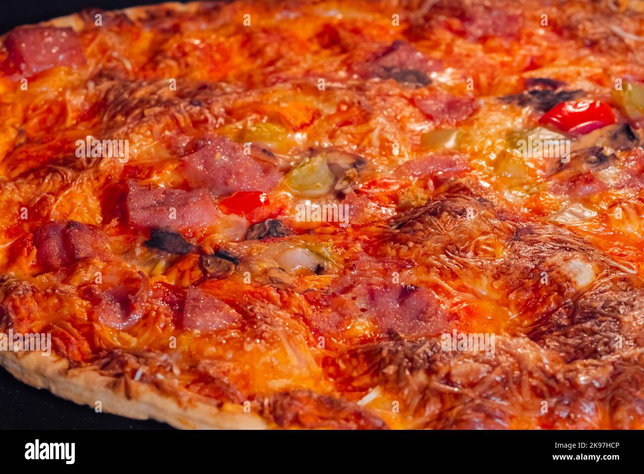 Burnt homemade pizza in electric oven macro, close up Stock Photo Alamy