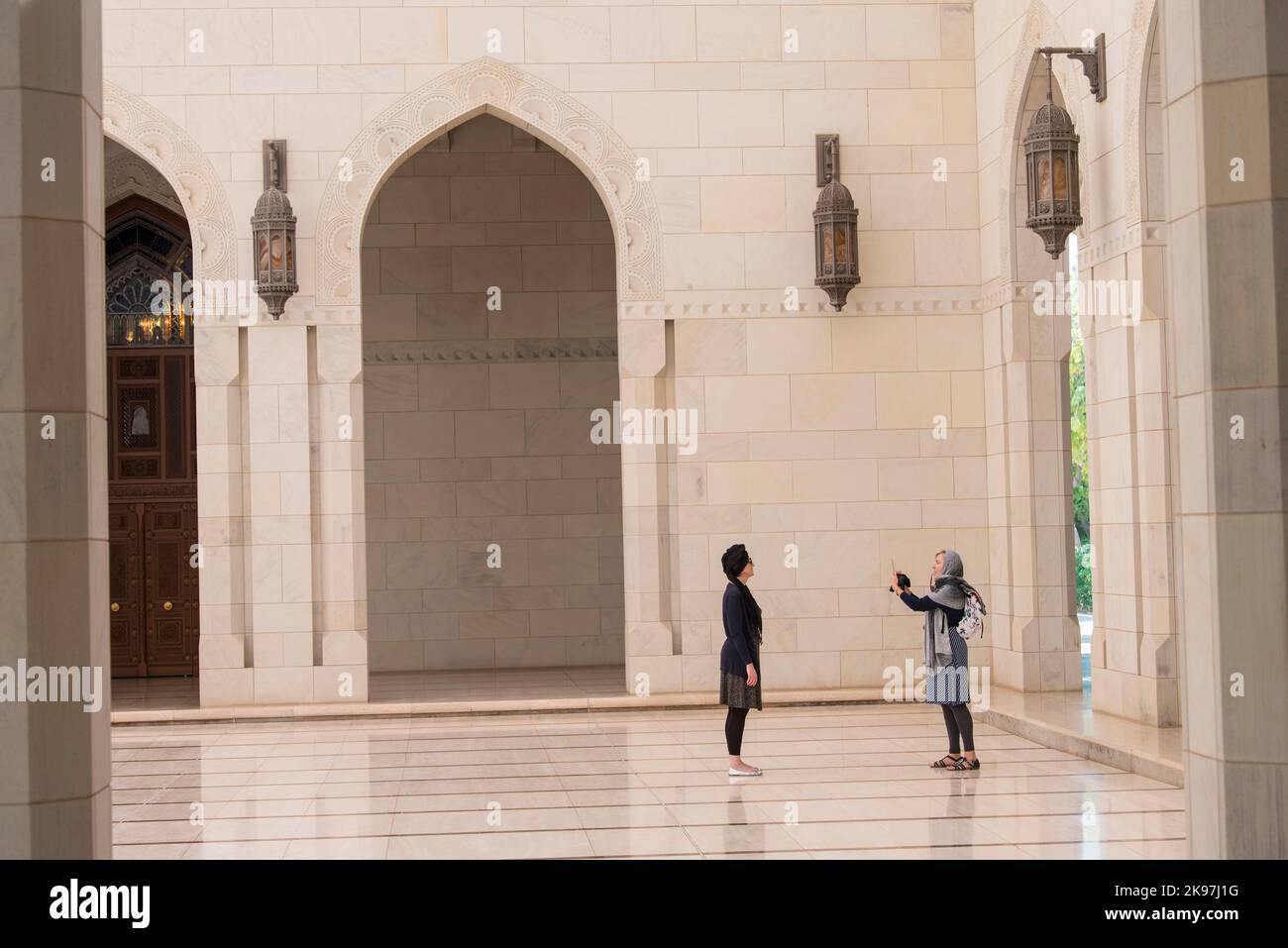 Muscat, Oman - March 05,2019 : Tourists tour in the Sultan Qaboos Grand Mosque. Stock Photo