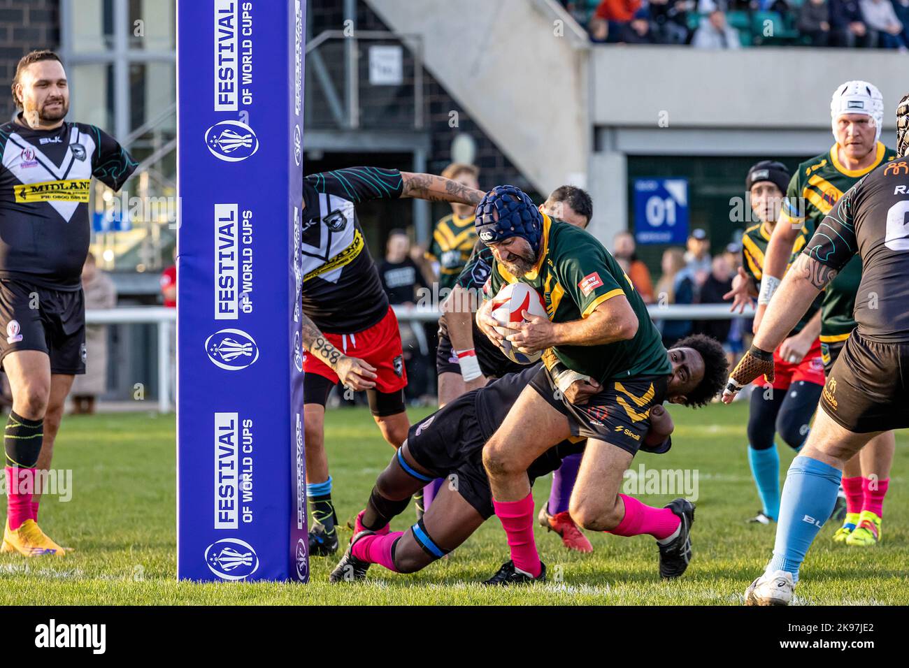 2022 Physical Disability Rugby League World Cup at Victoria Park, Warrington. Australia took on New Zealand. Autralian runs through a tackle to score Stock Photo