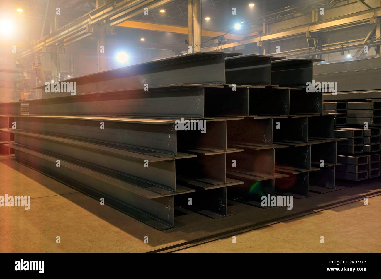 Warehousing in the workshop at the plant stock of metal I-beams profile ...