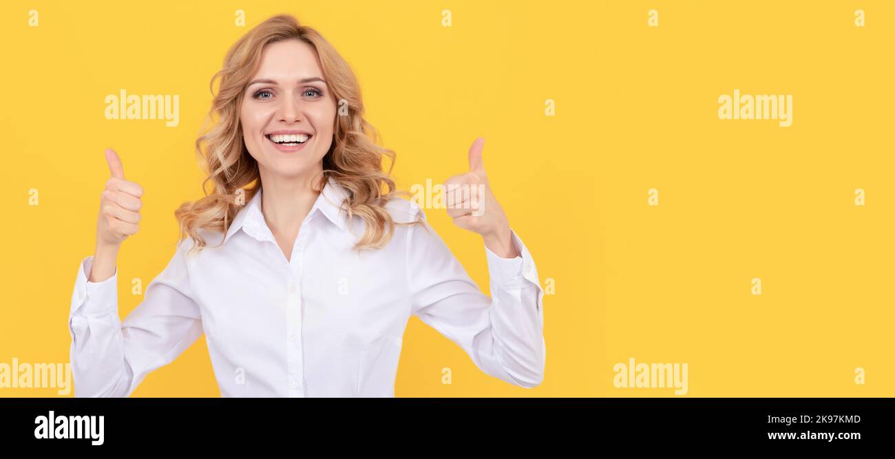 successful businesswoman. female boss ceo. thumb up. cheerful blonde woman in white shirt. Woman isolated face portrait, banner with mock up copy Stock Photo