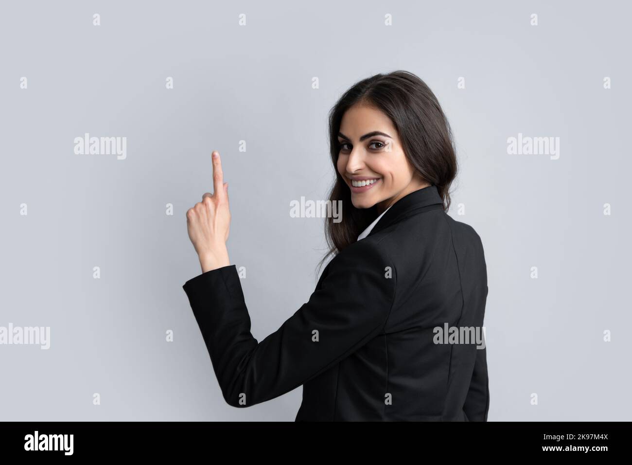 Woman point at copy space, showing copyspace pointing. Promo, girl