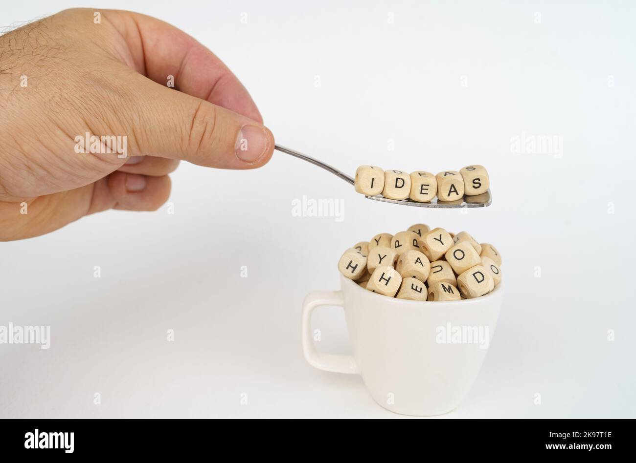 Business concept. Cubes with the image of letters are poured into the ...
