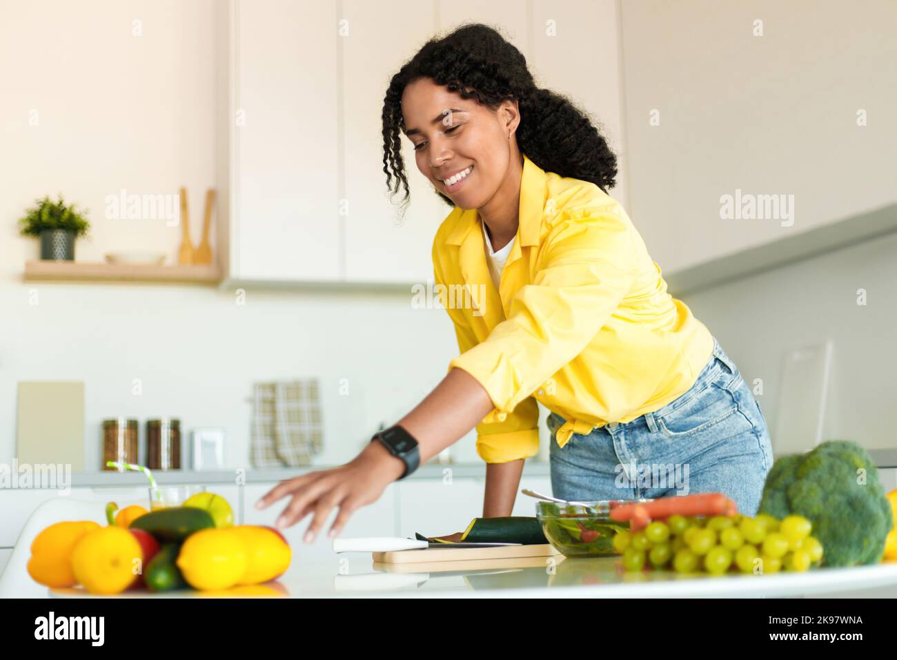 Healthy food to boost your immune system. Young african american woman ...