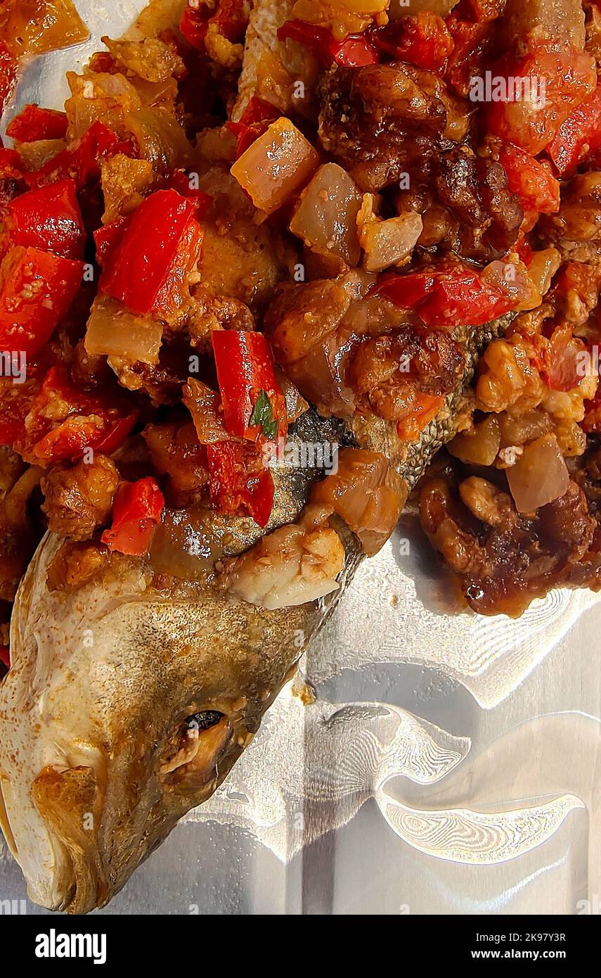 Baked sea bass with roasted vegetables Stock Photo - Alamy
