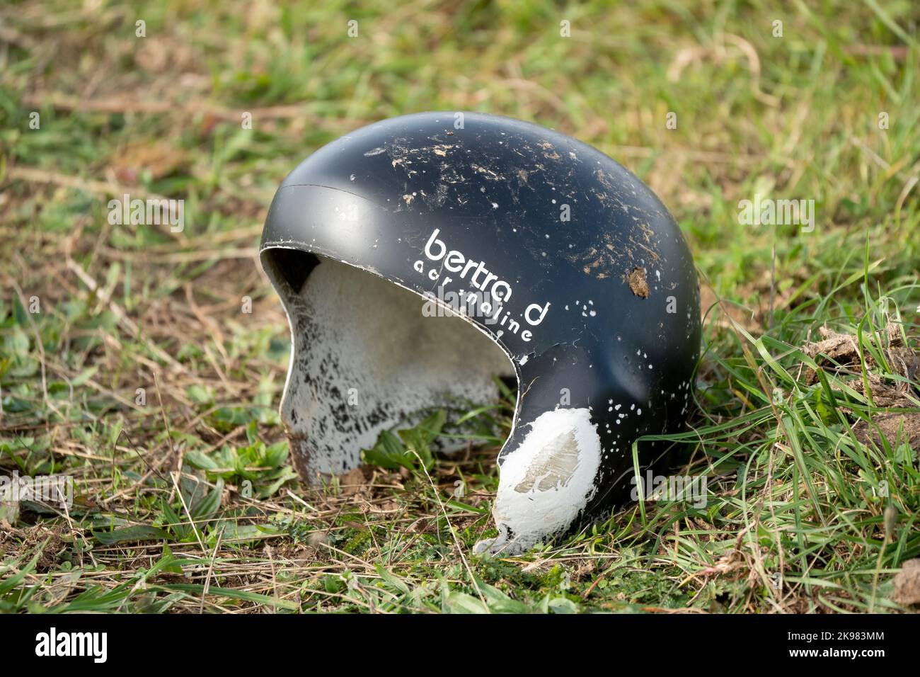 close up of an abandoned black open face motor cycle helmet Stock Photo