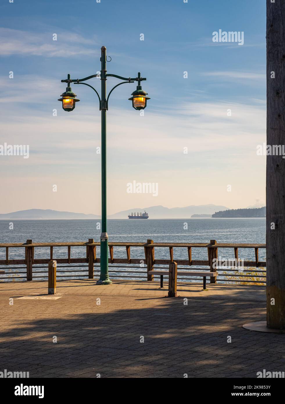 Glowing street lamp at the harbour in Vancouver Island. View from the pier. Nobody, travel photo, selective focus Stock Photo