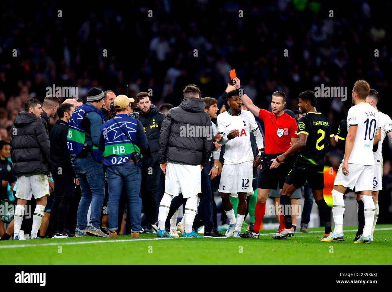 Tottenham Hotspur manager Antonio Conte is shown a red card by referee