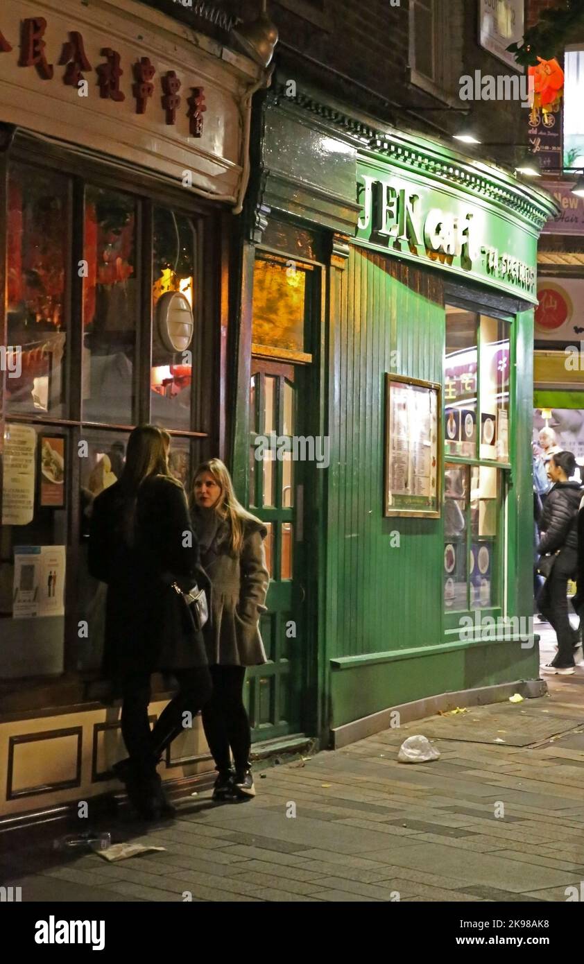 Friends talking in China Town London UK Stock Photo