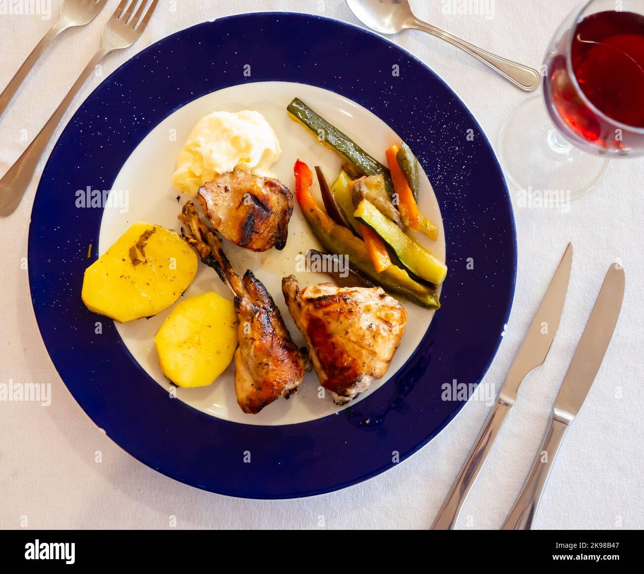 Roasted rabbit served with vegetable garnish Stock Photo