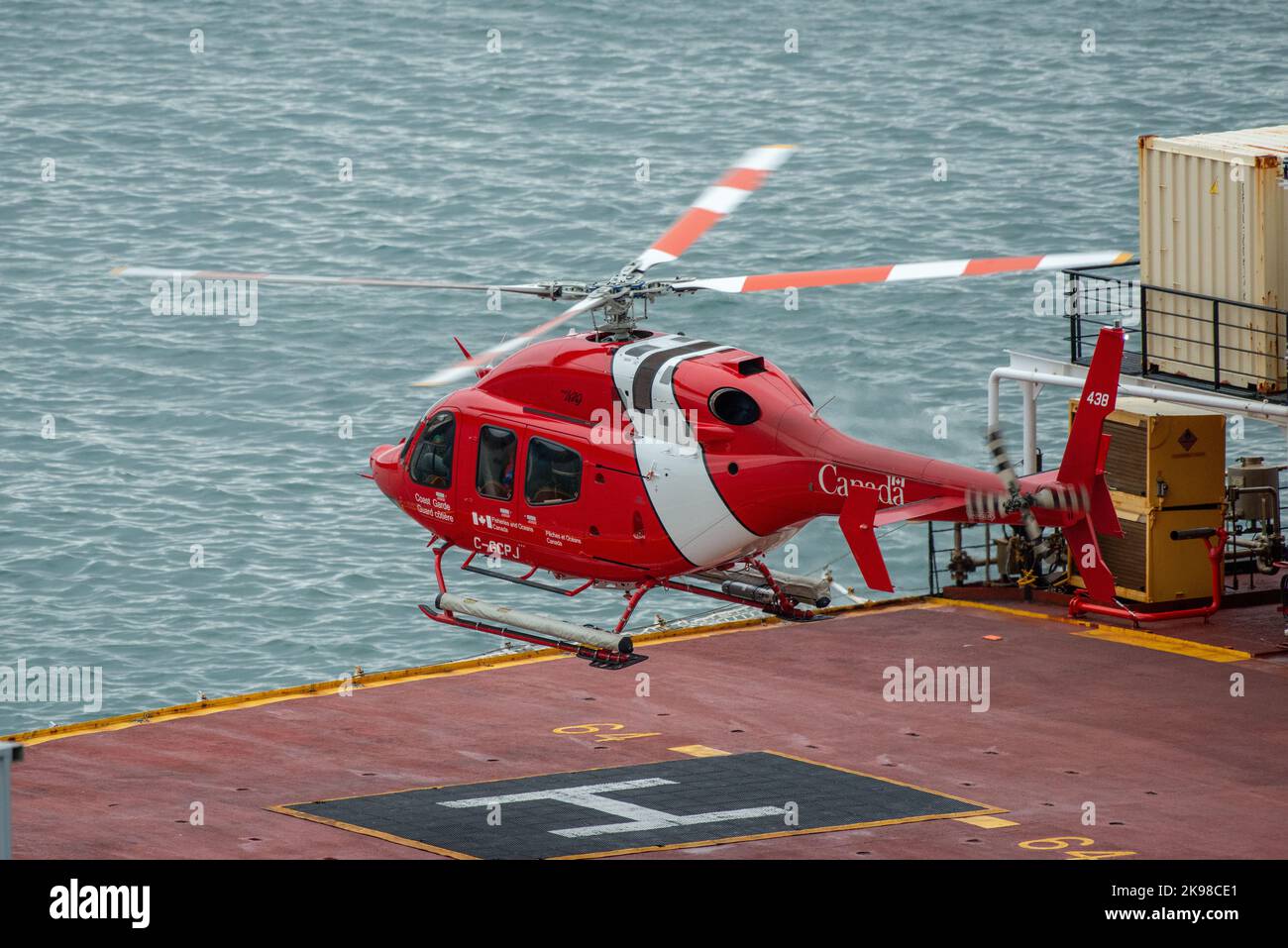 St. John's, Newfoundland, Canada-November 2022: A Canadian Coast Guard cormorant helicopter or chopper on the helipad of a large Coast Guard ship. Stock Photo
