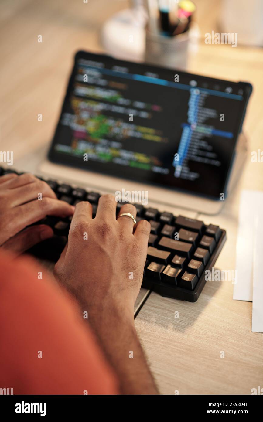 Hands of software developer typing on keyboard Stock Photo