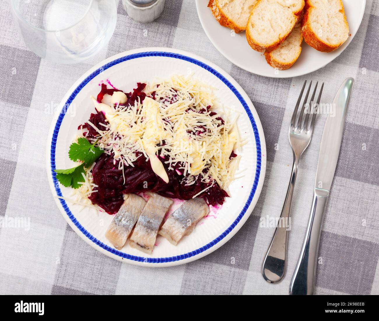 Beetroot served with cheese and pickled mackerel Stock Photo