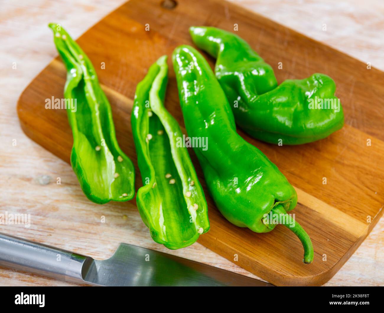 Table Peper Green pepper on kitchen table Stock Photo - Alamy