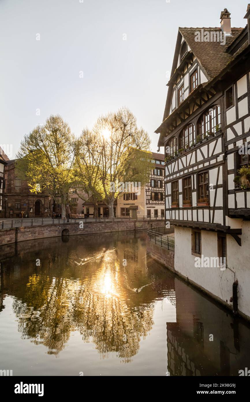 Traditional old alsatian houses at sunset from Pont st. Martin on a canal in Petit Venice (Small Venice) in Stasbourg in Alsace in the department of H Stock Photo