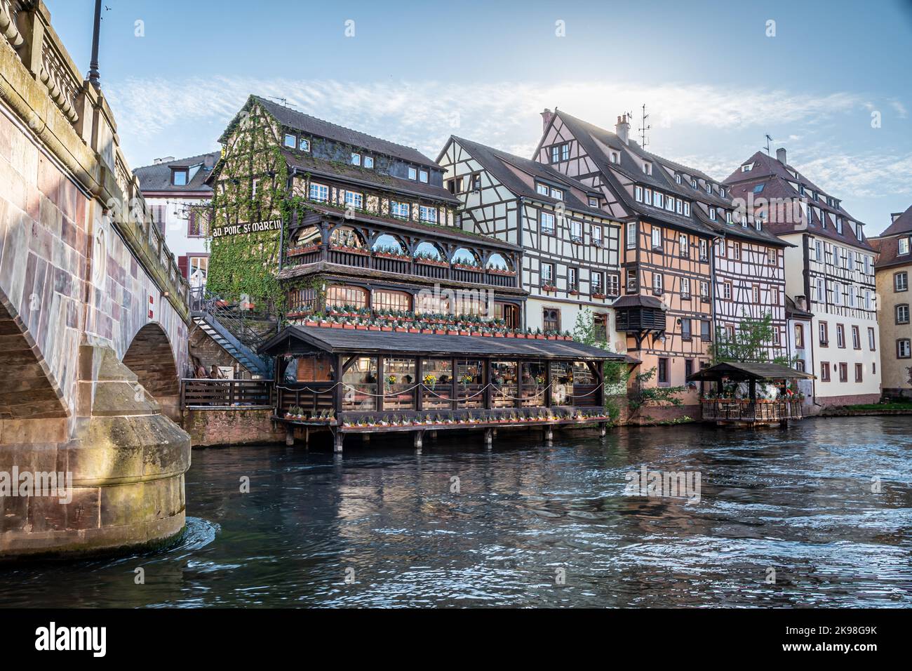 Traditional old alsatian houses and Pont st. Martin on a canal in Petit Venice (Small Venice) in Stasbourg in Alsace in the department of Haut-Rhin of Stock Photo