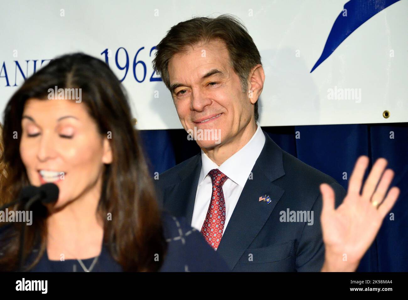 Harrisburg, Untied States. 26th Oct, 2022. Republican candidate for Senator Mehmet Oz listens as Former Governor of South Carolina Nikki Hailey speaks in Harrisburg, PA, USA on October 26, 2022. TV-personality Dr. Oz runs in a tight race against Democrat former Lt. Governor of Pennsylvania John Fetterman. Credit: OOgImages/Alamy Live News Stock Photo