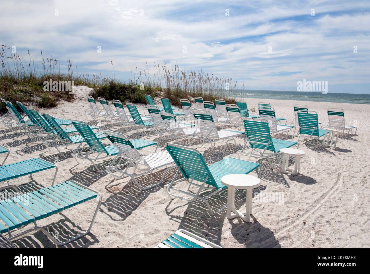 Beach chairs on a white sandy beach in Bradenton Beach on the Gulf of Mexico in Florida Stock Photo