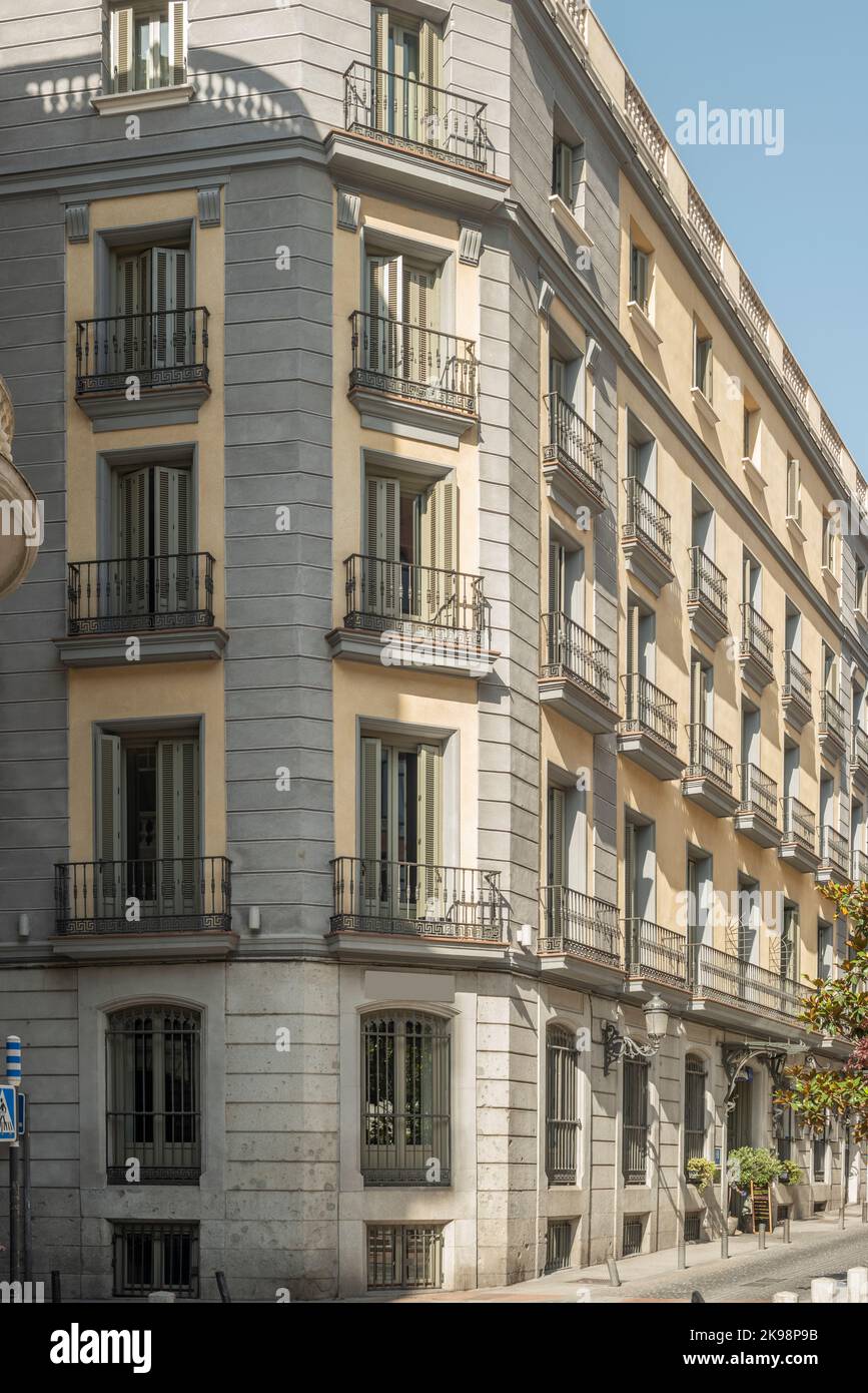 Facades of urban residential apartment buildings with metal balconies ...