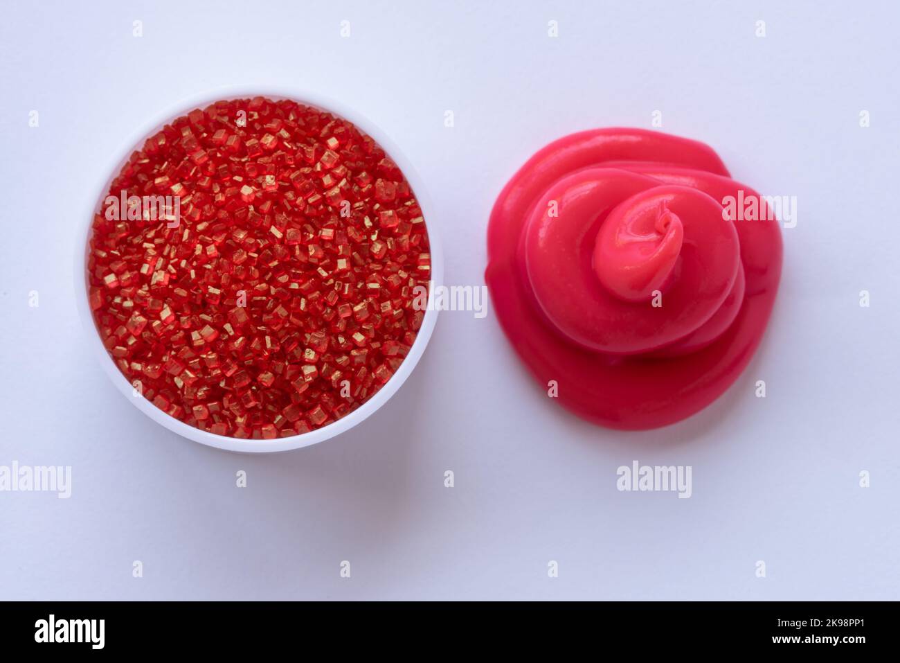 Red Sprinkles and Red Icing Stock Photo