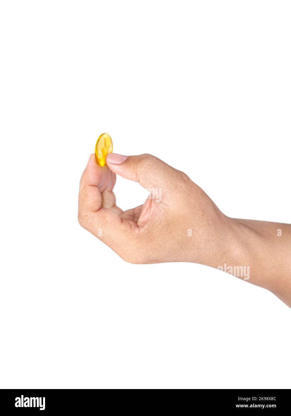 Hand holding omega 3 capsules on white background close up high