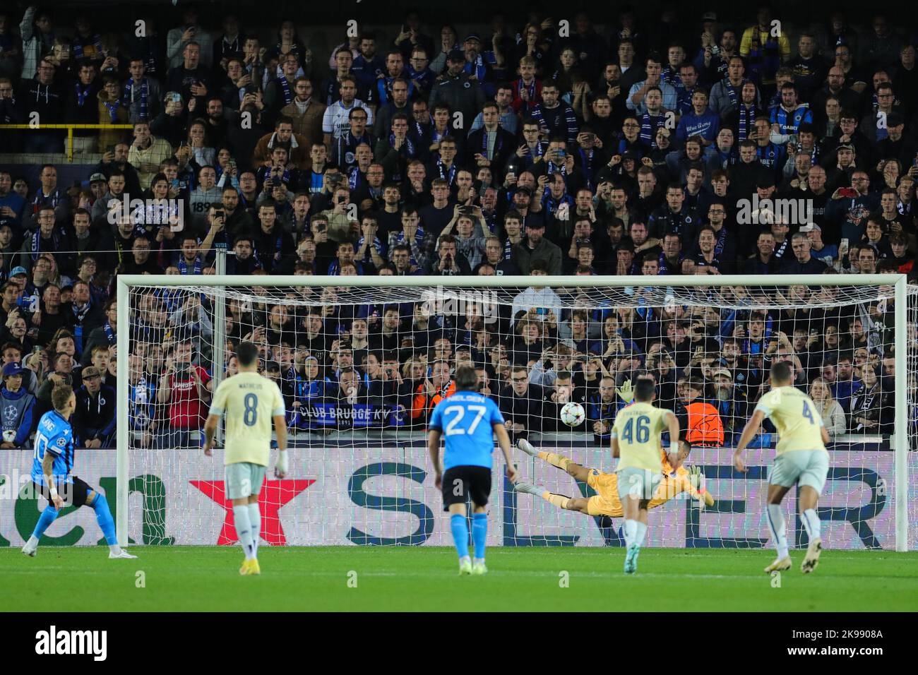 Bruges, Belgium. 26th Oct, 2022. Goalkeeper Diogo Costa (2nd R) of FC Porto saves a penalty kick by Club Brugge's Noa Lang during the UEFA Champions League Group B football match between Club Brugge and FC Porto in Bruges, Belgium, Oct. 26, 2022. Credit: Zheng Huansong/Xinhua/Alamy Live News Stock Photo