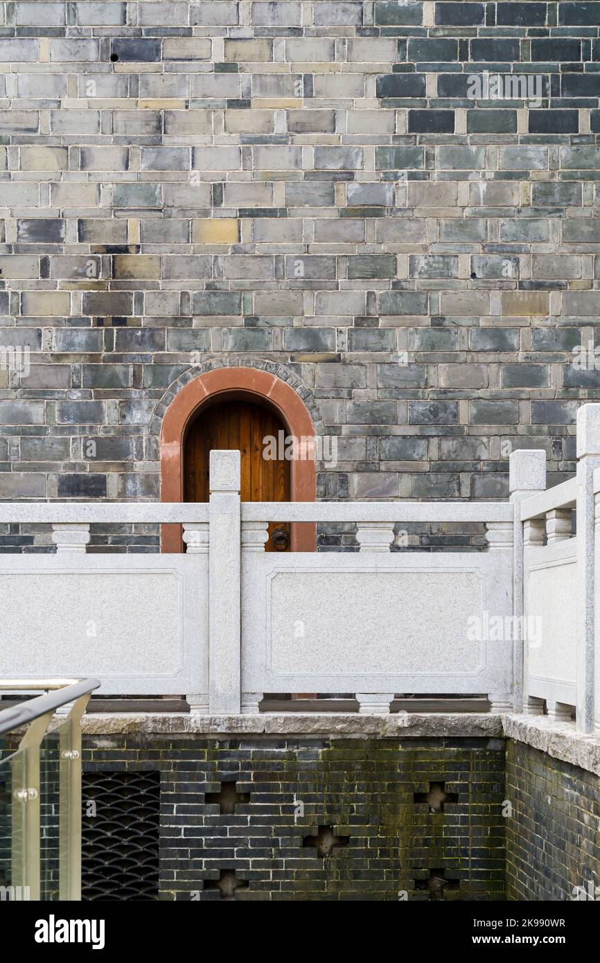 old wooden door in the stone wall Stock Photo - Alamy