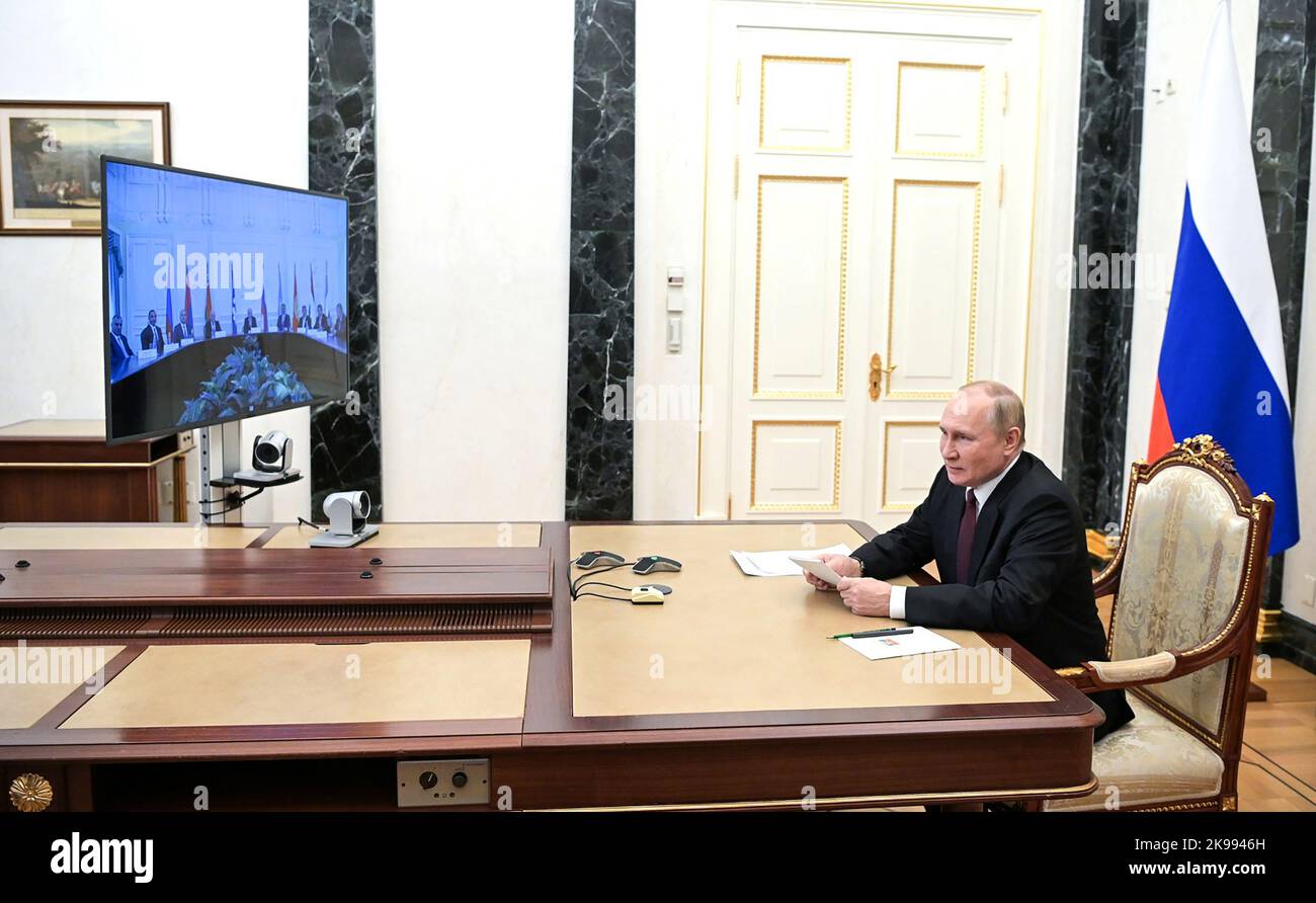 Russian President Vladimir Putin chairs a meeting with the heads of delegations of the Conference of Heads of Security and Intelligence Agencies of the Commonwealth of Independent States (CIS) member countries via a video link on October 26, 2022, in Moscow, Russia. The Kremlin said in a statement that President of Russia, Supreme Commander-in-Chief of the Armed Forces, Vladimir Putin monitored a military exercise of the ground, naval, and air components of the Strategic Deterrence Forces, which included practice launches of ballistic and cruise missiles, which all reached their designated ta Stock Photo