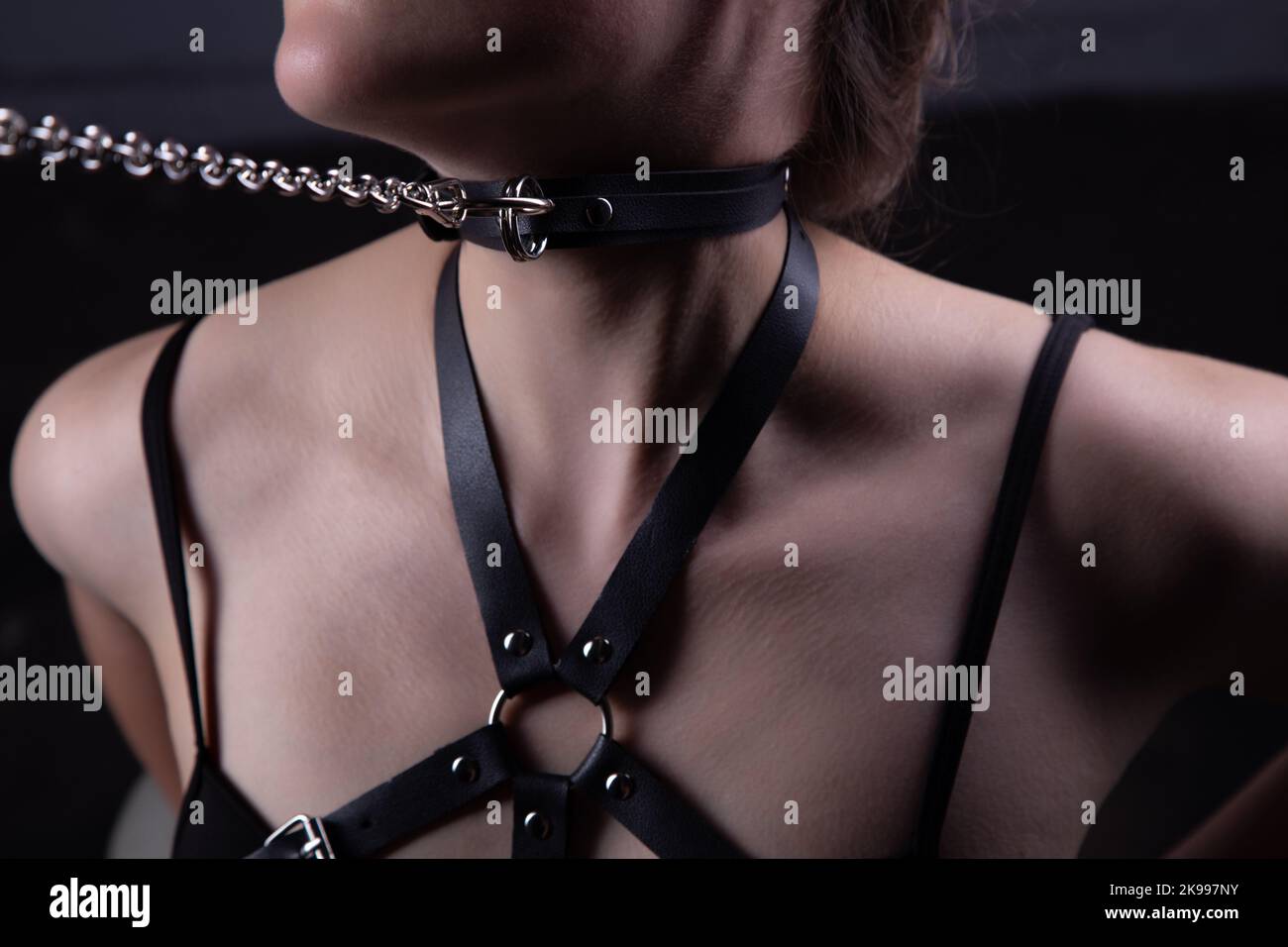 Photo of womans neck in bandage belt with chain Stock Photo