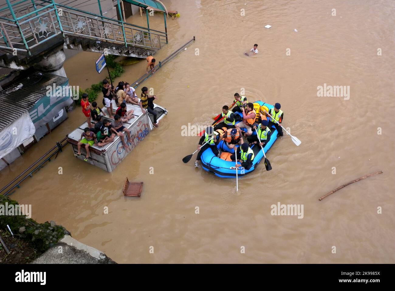 Jakarta, Indonesia - January 18, 2014 : Officers are evacuating residents trapped by floods in Jakarta - Indonesia Stock Photo