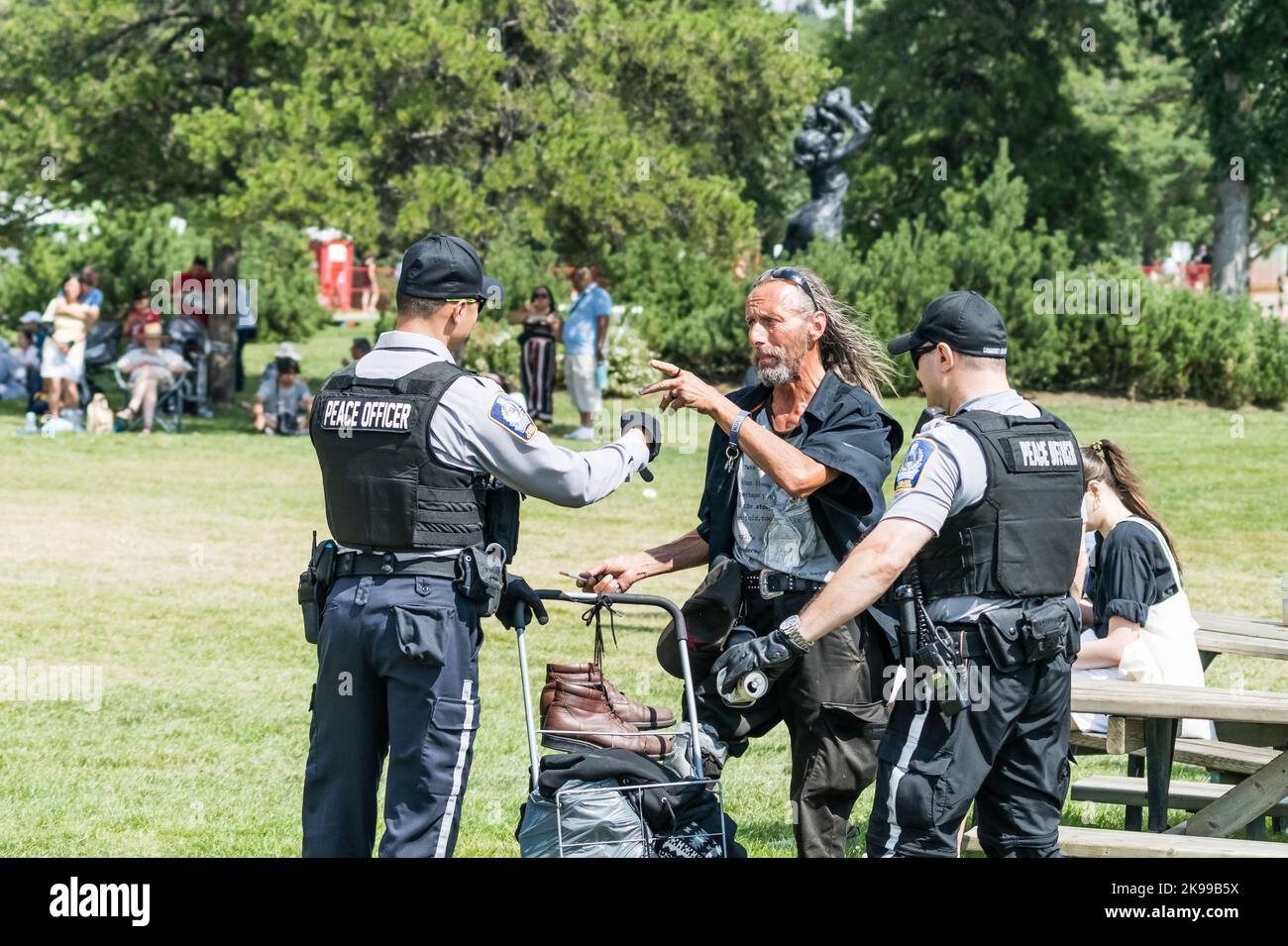 Edmonton, Canada, July30, 2022:: Peace officers  are negotiating with homeless at Heritage festival in Hawrelak park Stock Photo