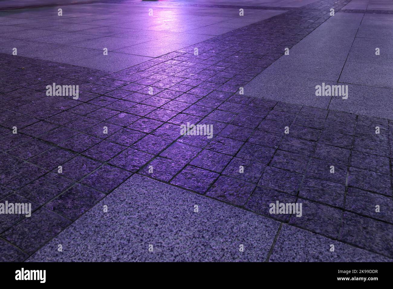 View of paving stones on city square at night, closeup Stock Photo Alamy