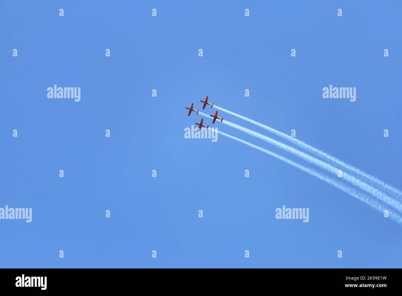 Modern airplanes flying in blue sky Stock Photo - Alamy