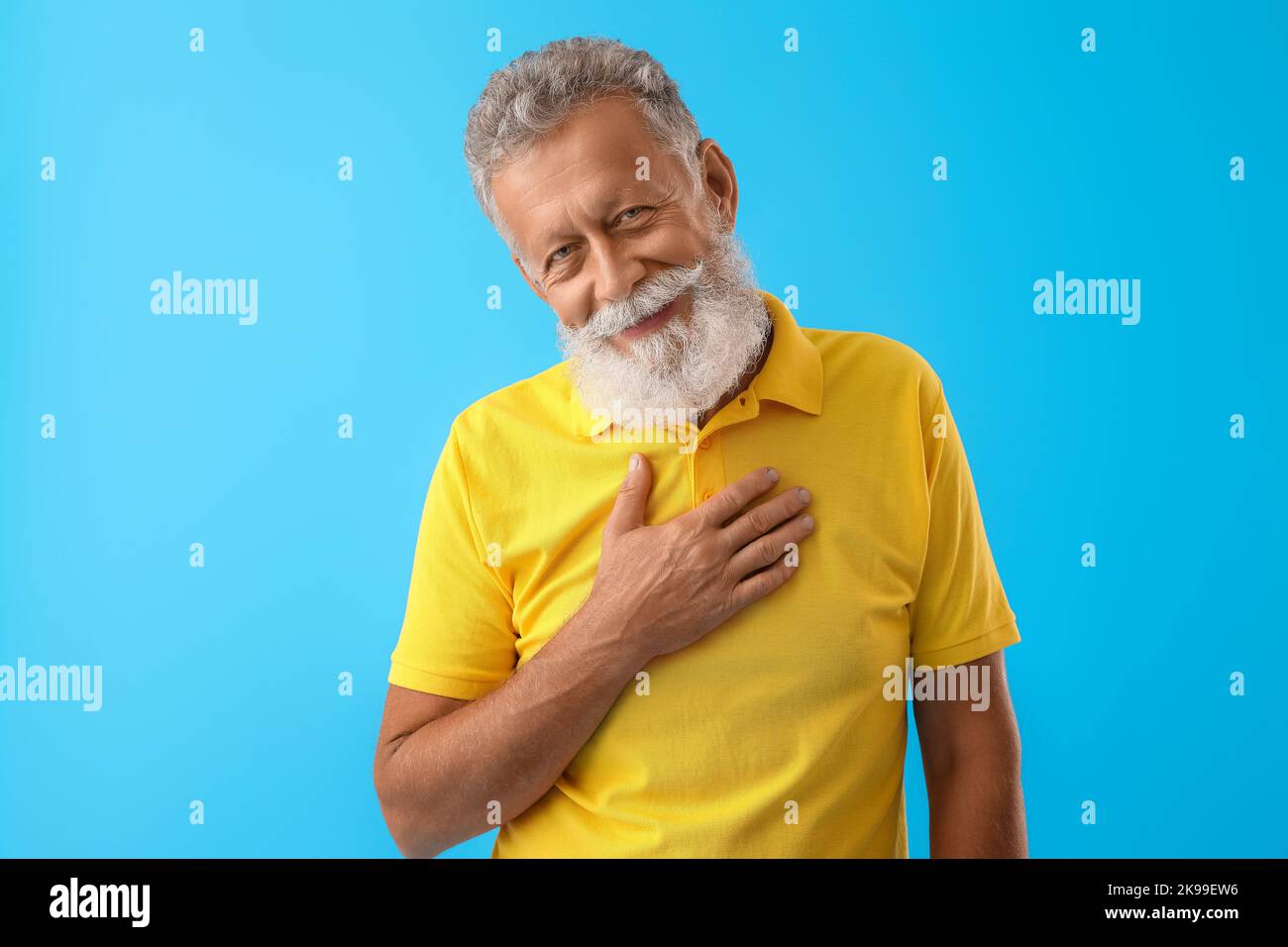 Bearded man in yellow shirt hi-res stock photography and images - Alamy