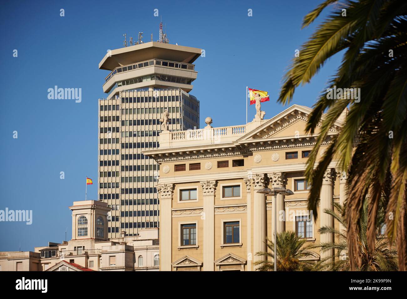 Catalonia capital city Barcelona in Spain. Edifici Colón  a office skyscraper and El Mundial Palace O Estación Marítima Stock Photo