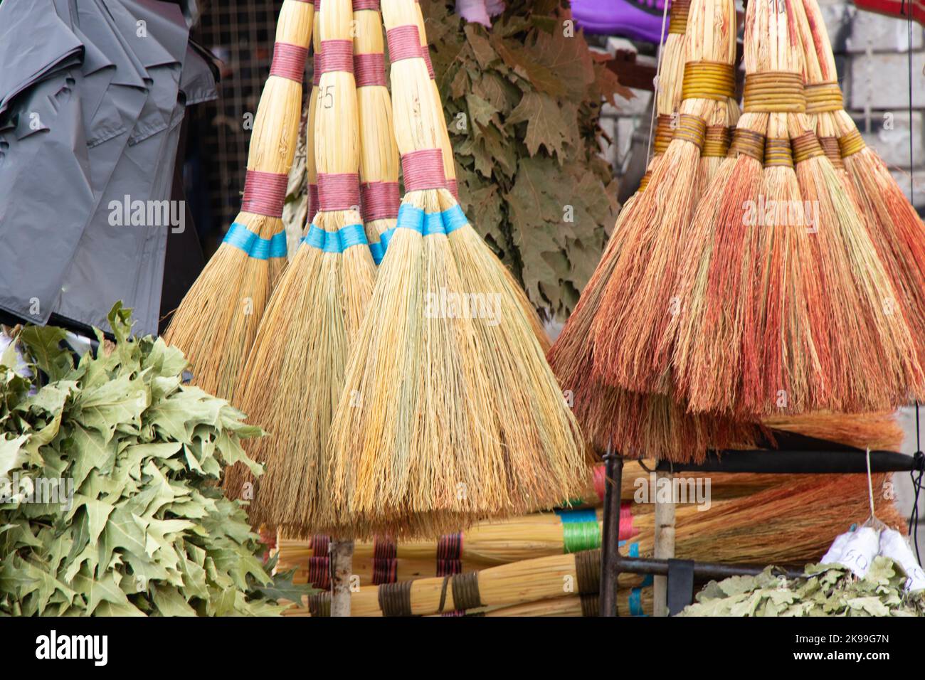 brooms on a window at a bazaar in the city of Dnipro Stock Photo