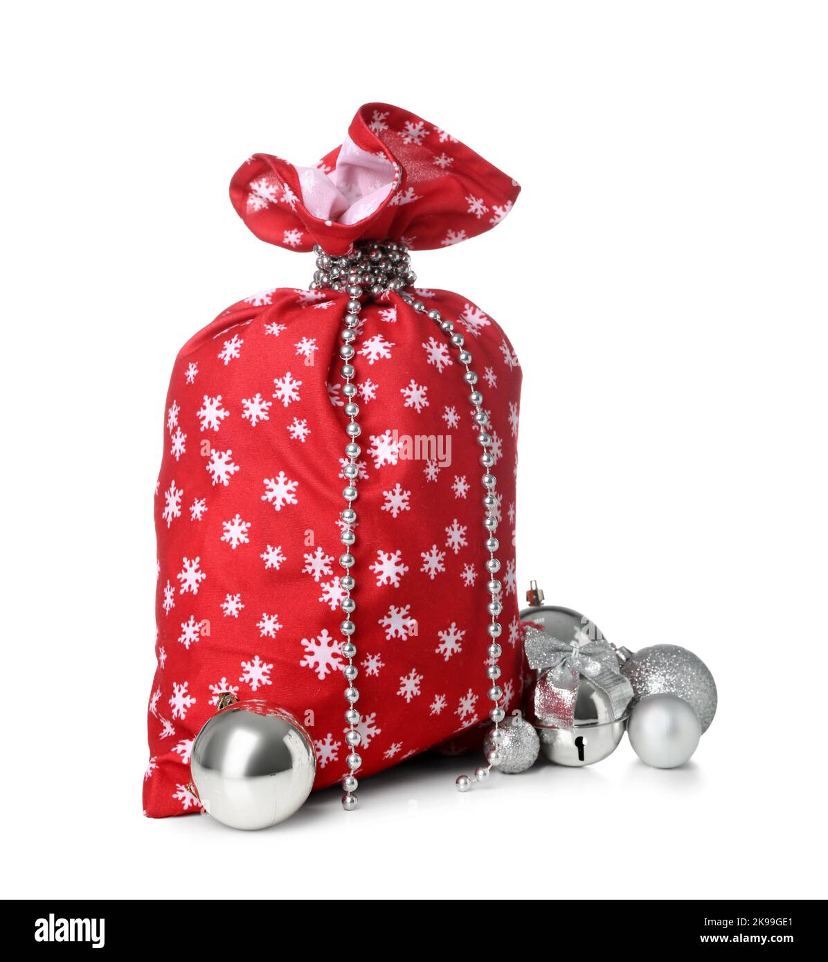 Santa Claus bag full of decorations on white background Stock Photo - Alamy