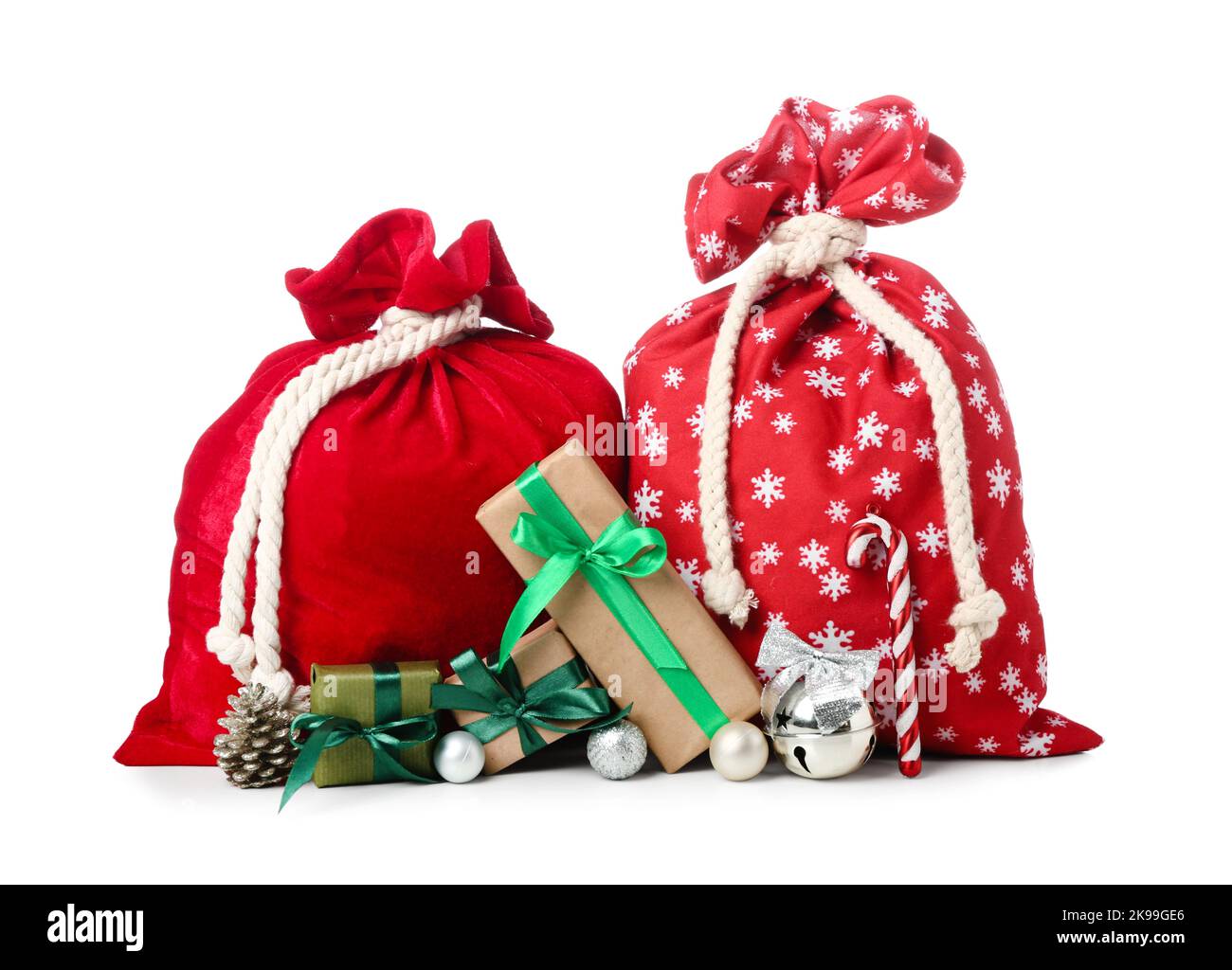 Santa Claus bags with decorations and gifts on white background Stock ...