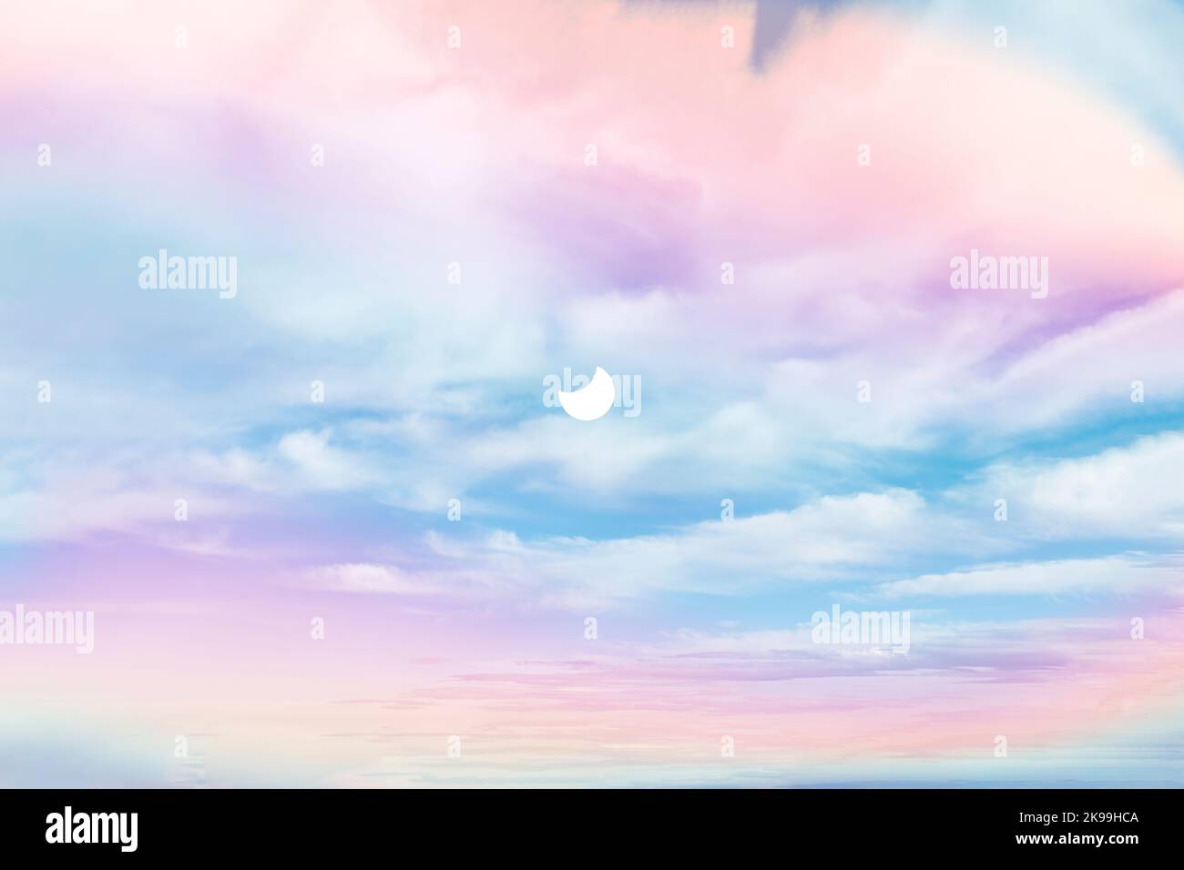 Solar eclipse in the among the multicolored sky Stock Photo