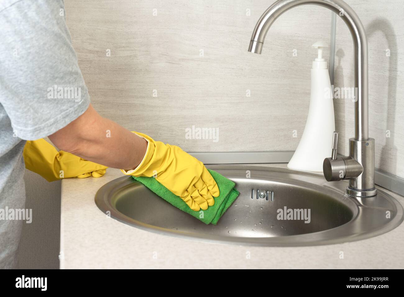 Cleaning. Cleaning service worker in rubber protective cleaning and