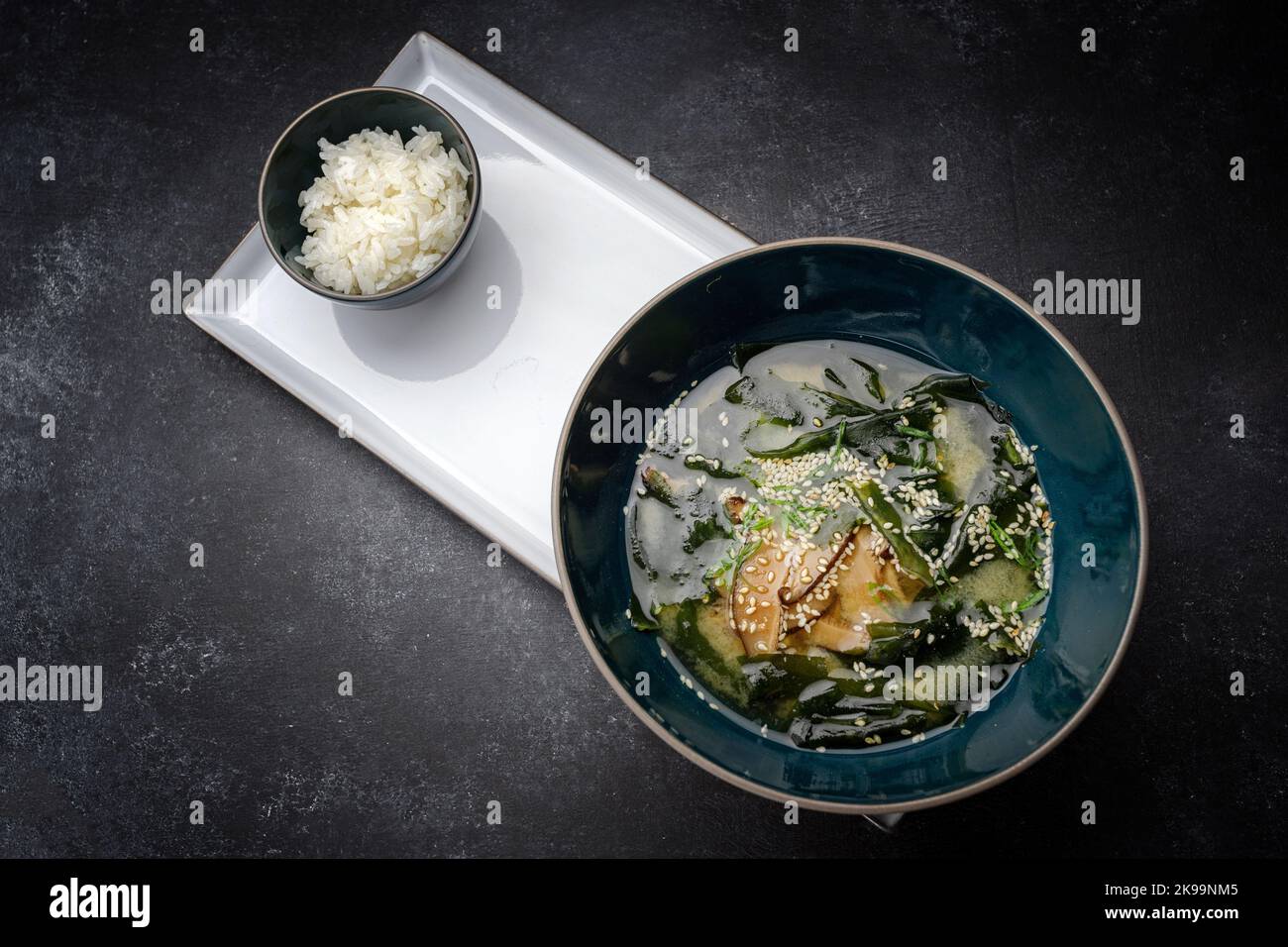 Miso soup with shiitake mushrooms and rice on a dark background Stock Photo