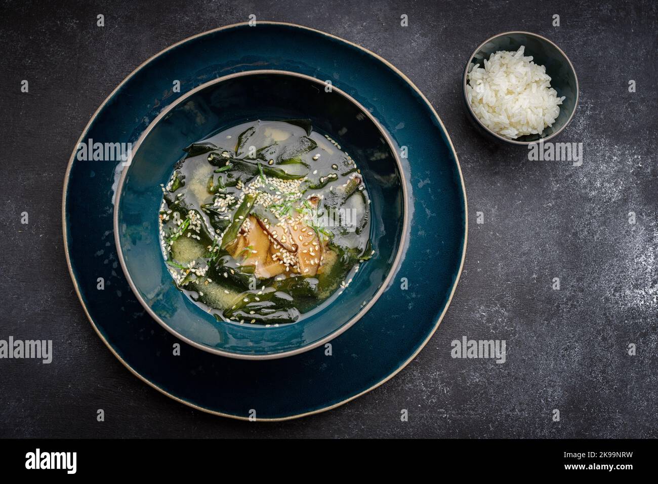 Miso soup with shiitake mushrooms and rice on a dark background Stock Photo