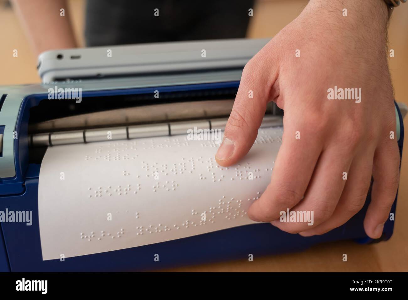 Blind man using braille typewriter Stock Photo Alamy