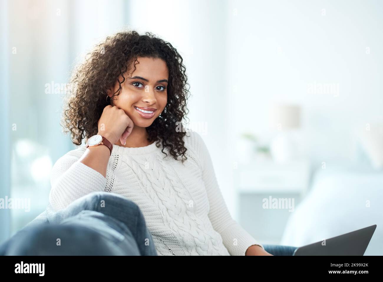 Im always more relaxed when Im at home. a beautiful young woman spending the day at home. Stock Photo
