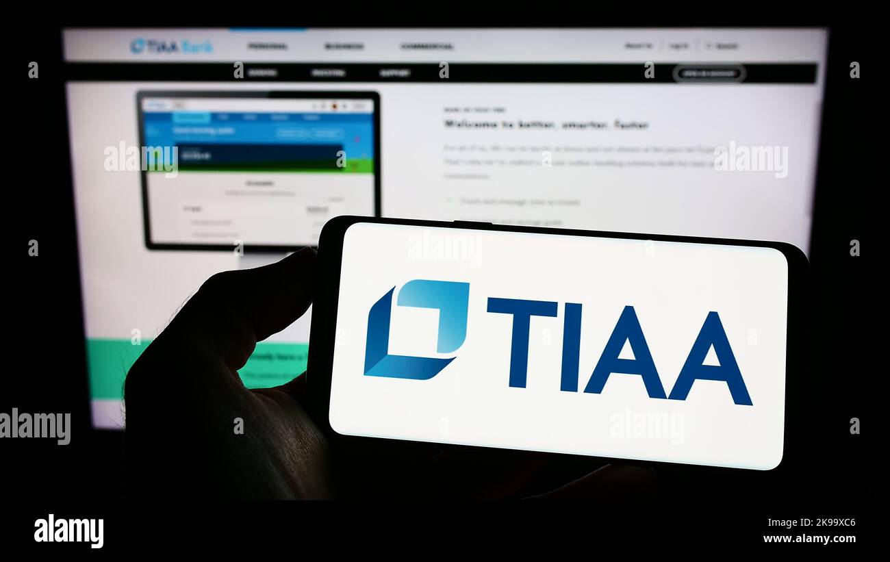 Person holding cellphone with logo of US financial services company