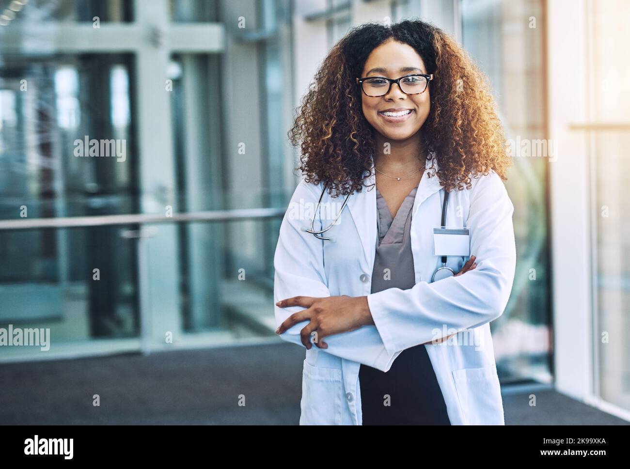 Seeing you healthy makes me happy. Portrait of a female doctor standing in a hospital. Stock Photo