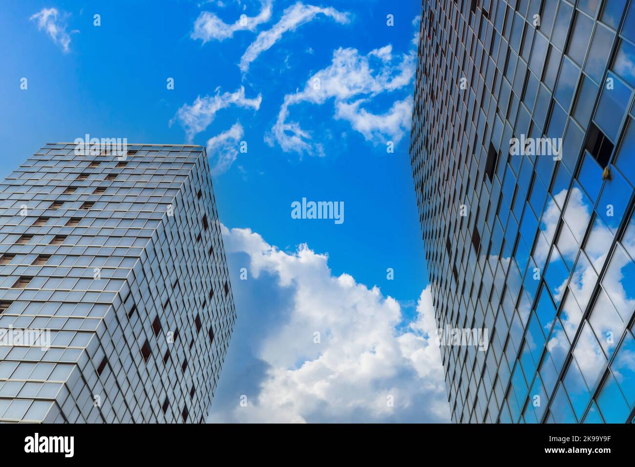 High towers and reflexions of the cloudy sky Stock Photo